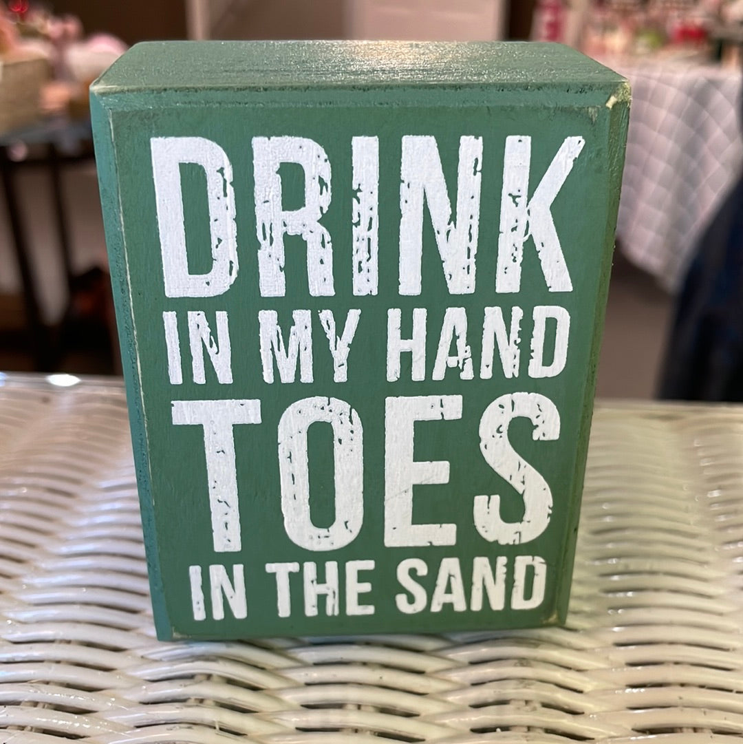 Toes in Sand Sign